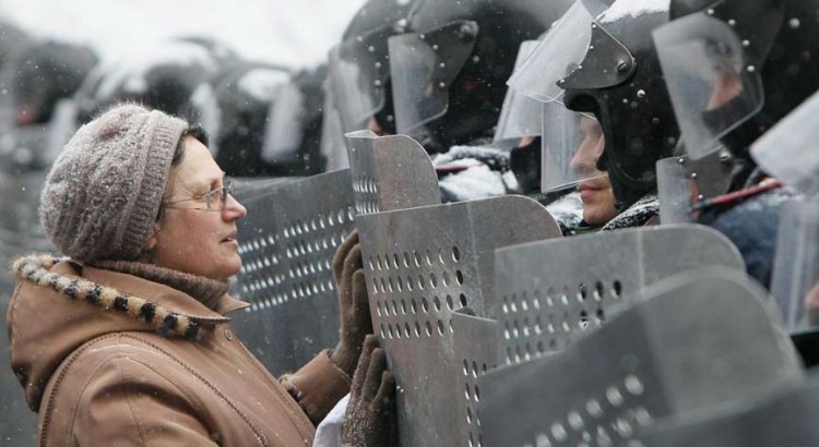 A woman addresses Ukrainian Interior Ministry troops who formed a battle line during the clashes. Gleb Garanich/Reuters