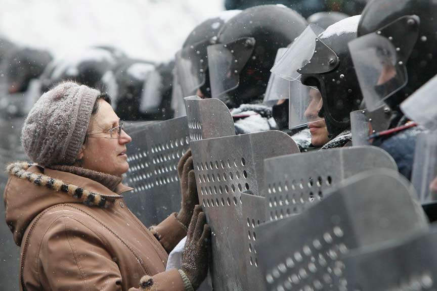 A woman addresses Ukrainian Interior Ministry troops who formed a battle line during the clashes. Gleb Garanich/Reuters